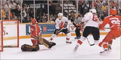  ?? CP FILE PHOTO ?? Mario Lemieux scores the winning goal with a shot that beat Soviet Union goaltender Sergei Mylnikov, as teammate Larry Murphy looks on in the 1987 Canada Cup final. It will be 30 years in September when that epic game was played.