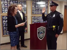  ?? Joseph Fitzgerald photo ?? Woonsocket Mayor Lisa Baldelli-Hunt swears in new Patrolman Robert Fry as Woonsocket Public Safety Director Eugene Jalette looks on.