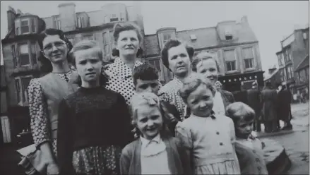  ??  ?? Jan Miller, front, second right, with mum Bella behind her and her aunts and cousins in Partick in the 50s