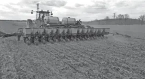  ?? COURTESY OF ROSS BISHOP ?? Ross Bishop, a beef and crops farmer in Washington County, was planting green no-till corn on May 6th.