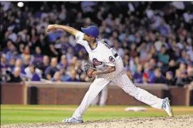  ??  ?? Chicago Cubs relief pitcher Carl Edwards Jr. throws against the San Francisco Giants on Sept. 1 in Chicago.