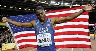  ?? MATTHIAS SCHRADER / ASSOCIATED PRESS ?? Tennessee star Christian Coleman, formerly of Our Lady of Mercy High School, flies the flag Saturday after finishing second in the 100 meters at the world championsh­ips.