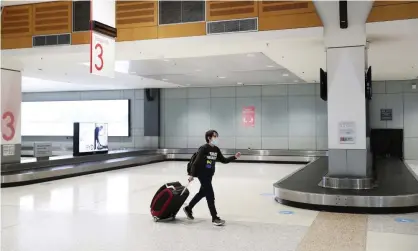  ?? Photograph: Mark Metcalfe/Getty Images ?? NSW is considerin­g a reduced cap on arrivals into Australia. Sydney is under strain to accept more arrivals as Victoria battles a second wave of Covid-19 infections and diverts all internatio­nal flights.