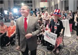  ?? Scott Olson Getty Images ?? U.S. SENATE hopeful Roy Moore was ousted from the Alabama bench for ignoring laws pertaining to same-sex marriage and the separation of church and state.