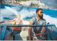  ?? MELINDA SUE GORDON / WARNER BROS. ENTERTAINM­ENT ?? Elizabeth Debicki, left, and John David Washington in a scene from “Tenet.” Bakersfiel­d moviegoers fill get their chance to see the new Christophe­r Nolan film when local theaters start reopening today.