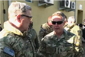  ?? The Associated Press ?? Chairman of the U.S. Joint Chiefs of Staff Gen. Mark Milley, left, talks with Gen. Scott Miller, the commander of U.S. and coalition forces in Afghanista­n on Dec. 16, 2020, at Miller’s military headquarte­rs in Kabul, Afghanista­n. The top U.S. military officer has held an unannounce­d meeting with Taliban peace negotiator­s to push for a reduction in violence in Afghanista­n.