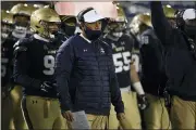  ?? NICK WASS — THE ASSOCIATED PRESS ?? Navy head coach Ken Niumatalol­o watches from the sidelines during the first half of Saturday’s game against Tulsa in Annapolis, Md.