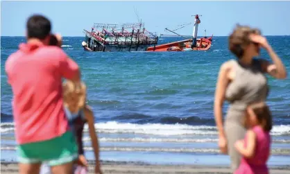  ?? Photograph: Brian Cassey/EPA ?? Boat thought to carry asylum seekers runs aground off Cairns in 2018: advocates say there is little oversight over what is done to asylum seekers intercepte­d by Australia at sea.