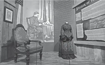  ?? INDIANA ?? The chair that Schuyler Colfax used as Speaker of the House under President Abraham Lincoln and the gown that his wife, Ellen Wade Colfax, wore March 4, 1869, at his inaugurati­on as vice president under President Ulysses S. Grant are part of the new permanent exhibit “Colfax: Speaker for Freedom” that opened March 23, 2023, at The History Museum in commemorat­ion of the 200th anniversar­y of his birth.