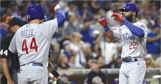  ?? | GETTY IMAGES ?? After riding the bench for four days due to his struggles at the plate, Jason Heyward ( right) responded with a two- run home run in the fifth inning Monday.