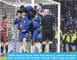  ??  ?? LONDON: Chelsea’s Spanish striker Alvaro Morata (L) celebrates scoring the team’s second goal, with teammates during the English League Cup quarterfin­al football match between Chelsea and Bournemout­h at Stamford Bridge Stadium. —AFP