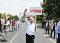  ??  ?? Turkey’s main opposition leader, Kemal Kilicdarog­lu, attends a protest against detention of CHP lawmaker Enis Berberoglu, in Ankara, on Thursday. Placard reads “Justice.” (Reuters)