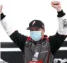 ?? Mark Humphrey/AP ?? ■ Cole Custer celebrates after winning a NASCAR Cup Series auto race Sunday in Sparta, Ky.