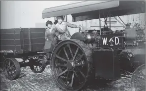  ?? PICTURES: TOPICAL PRESS AGENCY/ GETTY IMAGES ?? TAKING THE STRAIN: Top, a steam tractor belonging to the East Lancashire and Oldham Carrying Company, October 1906; Two women war workers driving a steam engine at a site for tank trials in Lincolnshi­re, March 1918.