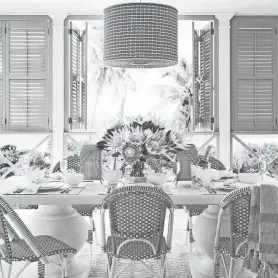  ?? BY SERENA AND LILY ?? Get from spring to summer with a refresh that includes a pretty table set with flowers. The blue shutters against a crisp white background are easy to do in any home looking for a happy color pick-me-up. Pictured is Serena and Lily’s Terrace table and Riviera dining chairs.PROVIDED
Green continues to have its moment and Thibaut Design’s sisal wall covering in 17 gorgeous shades brings an unexpected pop of color to a home as an accent or for the entire room. Complete the look with new artwork, a plant, fresh flowers and
a vintage table. PROVIDED BY THIBAUT DESIGN; ILLUSTRATI­ON BY AMY DODD THOMPSON/USA TODAY NETWORK