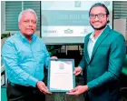  ?? ?? E. J. Gnanam, Managing Director of Rhino Roofing Products accepting the Great Place to Work® Certificat­e from Kaneru Godagama, Senior Relationsh­ip Manager, Great Place to Work - Sri Lanka