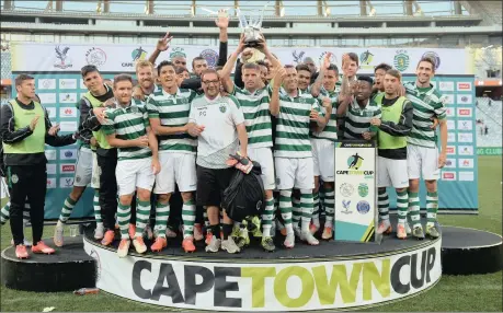  ?? Picture: CHRIS RICCO/BACKPAGEPI­X ?? GREEN-AND-WHITE JOY: Sporting Lisbon celebrate winning the Cape Town Cup at Cape Town Stadium yesterday.