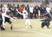  ?? MATT STAMEY/ASSOCIATED PRESS ?? Coastal Carolina kicker Massimo Biscardi sees his field-goal attempt blocked by Liberty in overtime Saturday night, ending the Cure Bowl with a 37-34 Flames victory.