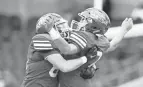  ?? JULIE VENNITTI BOTOS ?? Clinton-massie's Dawson Conley celebrates a touchdown by Kody Zantene against Ursuline on Friday.