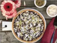  ?? ANDREA POTISCHMAN/SIMMER + SAUCE ?? This gluten-free Coconut-Chocolate Almond Tart uses almond flour, making it a perfect option for dessert for Passover or any night.