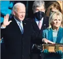  ?? Brendan Smialowski / AFP via Getty Images ?? Joe Biden, flanked by Jill Biden, takes the oath of office as the 46th president on Jan. 20.