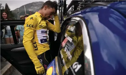  ??  ?? Julian Alaphilipp­e cuts a frustrated figure as he climbs into his team car following the abandonmen­t. Photograph: Marco Bertorello/AFP/ Getty Images