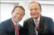  ?? PTI ?? Finance minister Arun Jaitley (right) with his Japanese counterpar­t Taro Aso, in Yokohama on Sunday