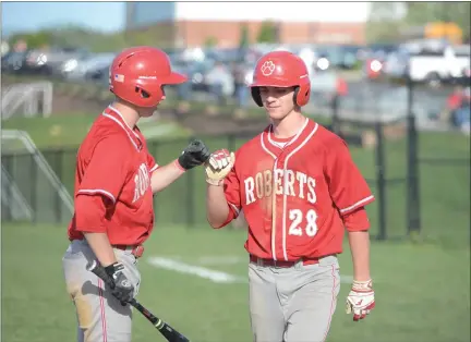  ?? OWEN MCCUE - MEDIANEWS GROUP FILE ?? Owen J. Roberts’ Sam Morris, right, celebrates with a teammate during a game in 2019. After a cancelled 2020season, Morris is the lone first team Mercury All-Area returner in 2021. More on Morris and the Wildcats and the rest of the area’s baseball teams inside on B3.