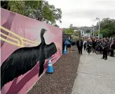  ?? ?? Students from Te Kura Kaupapa Ma¯ori o Tuia Te Matangi and other guests at the unveiling of new murals and panels at the entrance to Trafalgar Park.