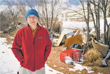  ?? GABRIELA CAMPOS/THE NEW MEXICAN ?? Dan Frazier walks through an arroyo near his home last week, where several homeless encampment­s have popped up. It is an issue he has tried to address with city officials.