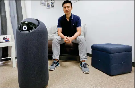  ??  ?? NXROBO CEO Lam Tin-lun poses with his BIG-i personal robot in a showroom inside his office in Shenzhen, China, on Saturday. REUTERS