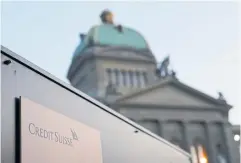  ?? BLOOMBERG ?? Signage for a Credit Suisse Group AG office near the Federal Palace, Switzerlan­d’s parliament building in Bern, Switzerlan­d.