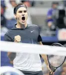  ?? Picture / AP ?? Roger Federer celebrates a tough victory over Frances Tiafoe in the first round of the US Open.