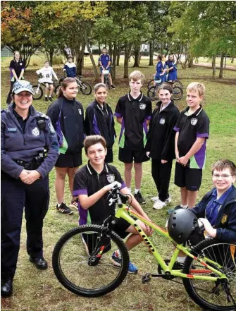  ?? PHOTO: BEV LACEY ?? PROUD DAY: Celebratin­g the completion of the Bike Build program are (front, from left) Snr Const Catherine Grutt, Year 9 student Sean Carroll and Year 6 student Benjamin Leahy with (back, from left) Shanayah Combo, Christa Hall, Sean Dalley, Sophie...