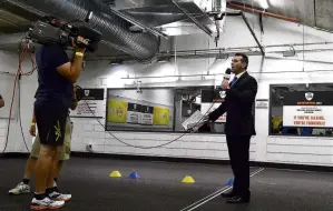  ?? PHOTO: GETTY IMAGES ?? On duty . . . Sattler shoots a piece to camera ahead of the Super Cup grand final in 2014.