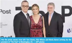  ??  ?? This file photo shows from left: Tom Hanks, Rita Wilson and Marty Baron arriving for the premiere of “The Post” in Washington, DC. — AFP photos