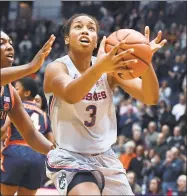 ?? Jessica Hill / Associated Press ?? UConn’s Megan Walker drives to the basket against Viriginia on Tuesday night in Hartford.