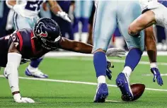  ??  ?? Texans defensive end Charles Omenihu dives to recover a fumble Sunday night. Omenihu started and had two of the team’s five sacks.