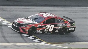  ?? ASSOCIATED PRESS ?? CHRISTOPHE­R BELL CROSSES THE FINISH LINE to win the NASCAR Cup Series road course at Daytona Internatio­nal Speedway on Sunday in Daytona Beach, Fla.