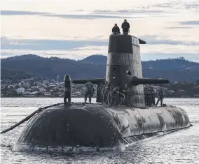  ?? ?? Royal Australian Navy submarine HMAS Sheean arrives for a logistics port visit in Hobart earlier this year. Picture: LSIS Leo Baumgartne­r/Australian Defence Force via Getty Images