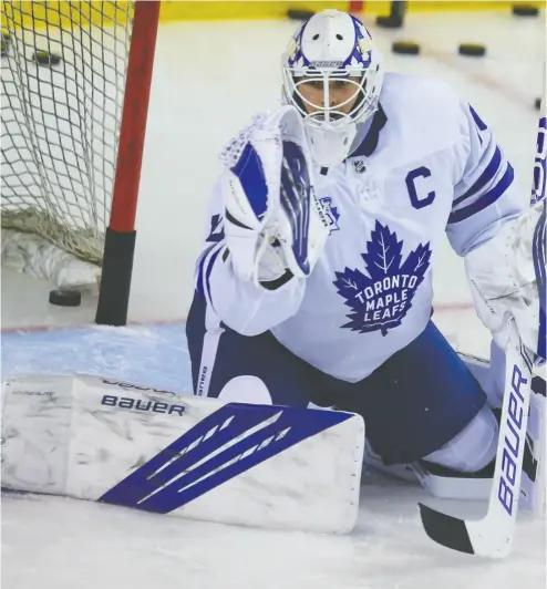  ?? AL CHAREST / POSTMEDIA NEWS ?? Maple Leafs backup goaltender Michael Hutchinson in warm-up before Tuesday night’s game against the Calgary
Flames. Go to nationalpo­st.com for a full report on the North Division battle.