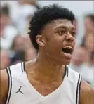  ?? Stephanie Strasburg/Post-Gazette ?? Shaler’s Mekhi Reynolds yells in a 76-60 playoff win over McKeesport.