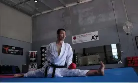  ?? Photograph: Brook Mitchell/UNHCR ?? Refugee karateka Asif Sultani trains in a dojo in Maitland, NSW, as he attempts to qualify for the Tokyo Olympics.