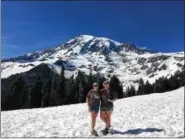  ?? RICH WOOD — FOR DIGITAL FIRST MEDIA ?? Hiking through the snow in shorts and T-shirts is a bonus when visiting Mt. Rainier, Wash., in late June.