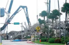  ?? AP PHOTO/LYNNE SLADKY ?? Rescue crews work in the rubble of the collapsed Champlain Towers South condominiu­m building on Tuesday in Surfside, Fla.