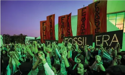  ?? AFP/Getty Images ?? Climate activists attending a protest against fossil fuels during the Cop28 in Dubai on Tuesday evening. Photograph: Giuseppe Cacace/