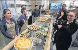  ?? AP PHOTO ?? Visitors taste cakes at the La Fabbrica Italiana Contadina (‘The Italian Farmer Factory’) agri-food park in Bologna, Italy.