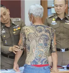  ?? AP PHOTO ?? CRIME L-INK: Murder suspect Shigeharu Shirai was arrested after being recognized by pictures of his tattoos.