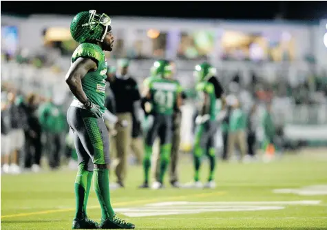  ?? MICHAEL BELL/Leader-Post ?? Tristan Jackson, left, ponders the scenario during a timeout late in the Saskatchew­an Roughrider­s’ 30-27 loss to the visiting Ottawa Redblacks on Saturday.