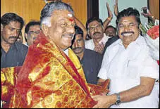  ?? HT PHOTO ?? O Panneersel­vam with Tamil Nadu CM Edappadi K Palanisami during his oath ceremony in Chennai on Monday.